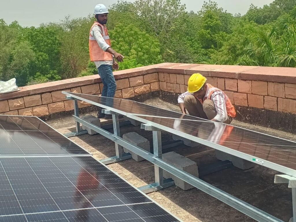 Service engineer cleaning / maintaining panels